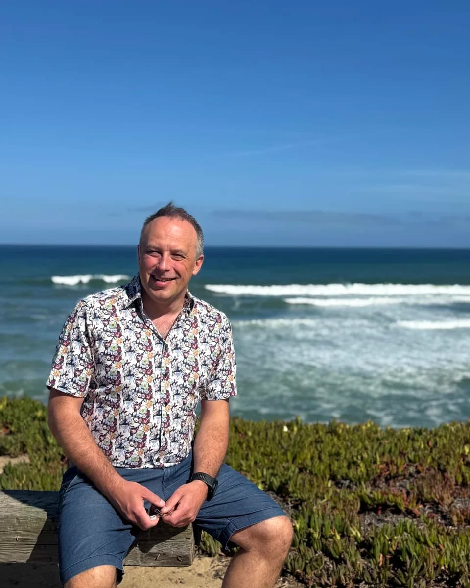 Marcin, creator of DoughTools, photographed outdoors by the sea.