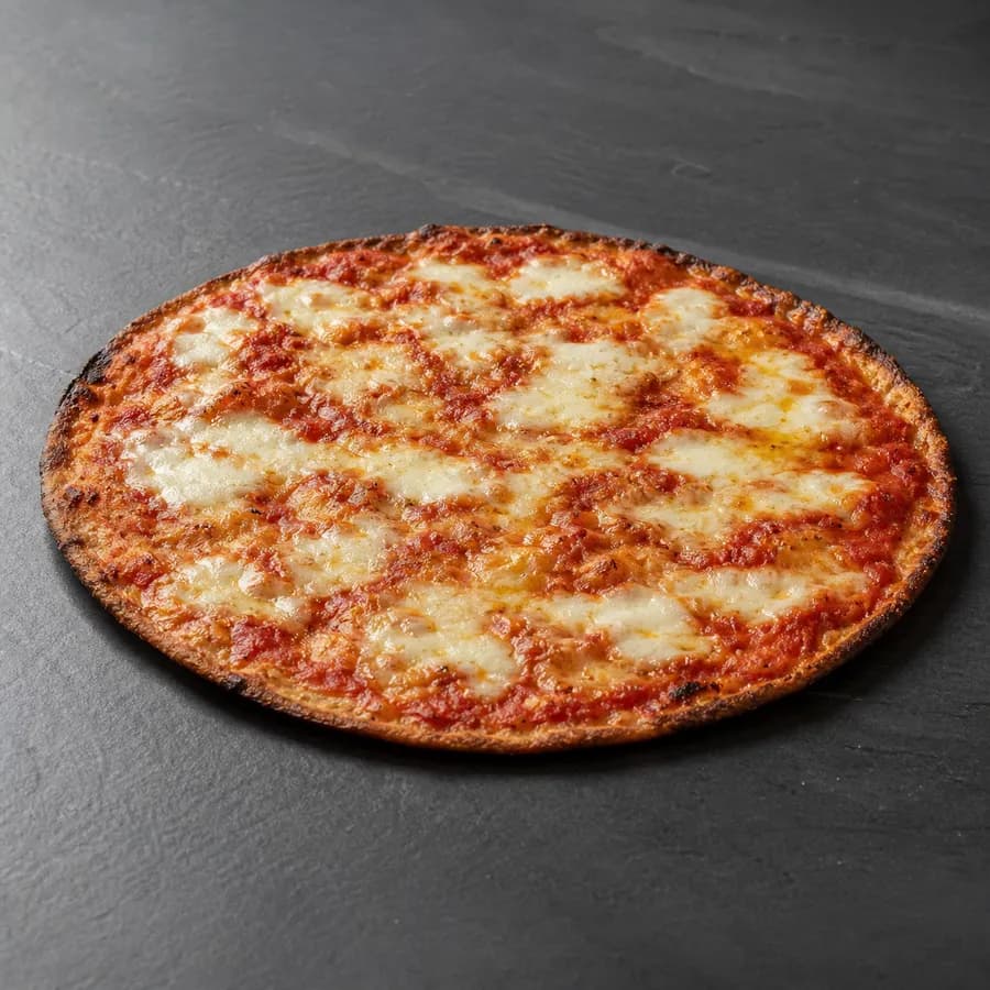 Roman Tonda-style round pizza with a very thin crisp base and low edge.